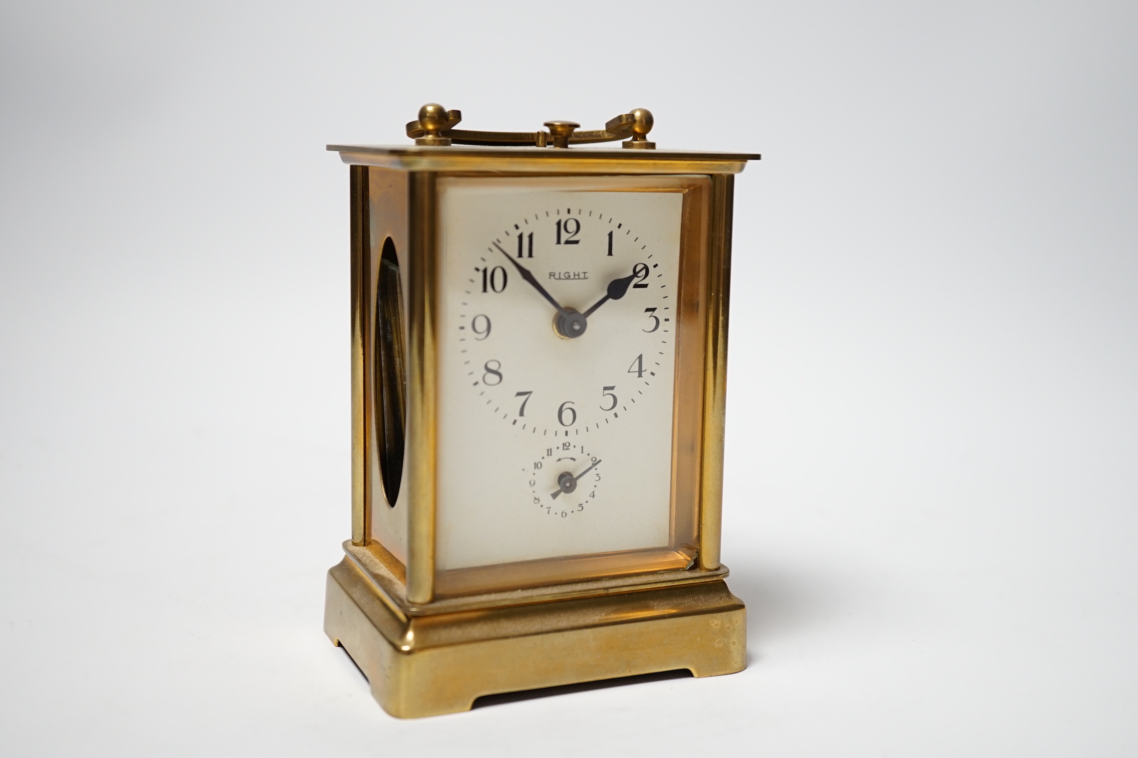 Two brass carriage timepieces; one with an alarm dial, the other in a drum case, tallest 11.5cm